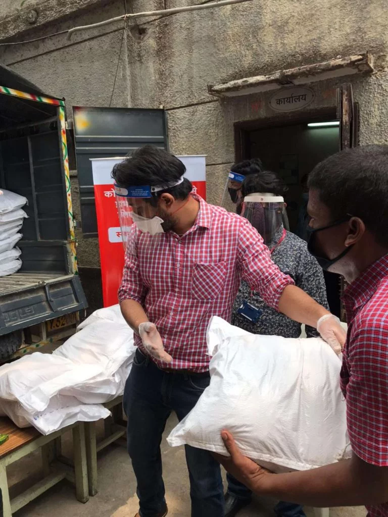 Text Box: Kotak employees distributing ration kits to Dihadi workers at APMC market, New Delhi